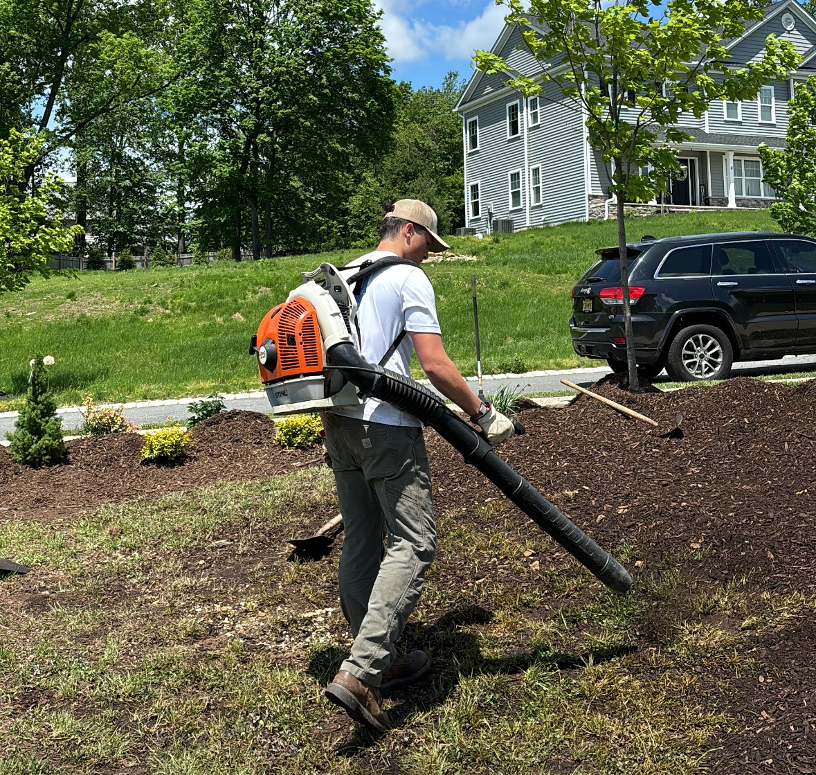 Crew handling mulch bed cleanup