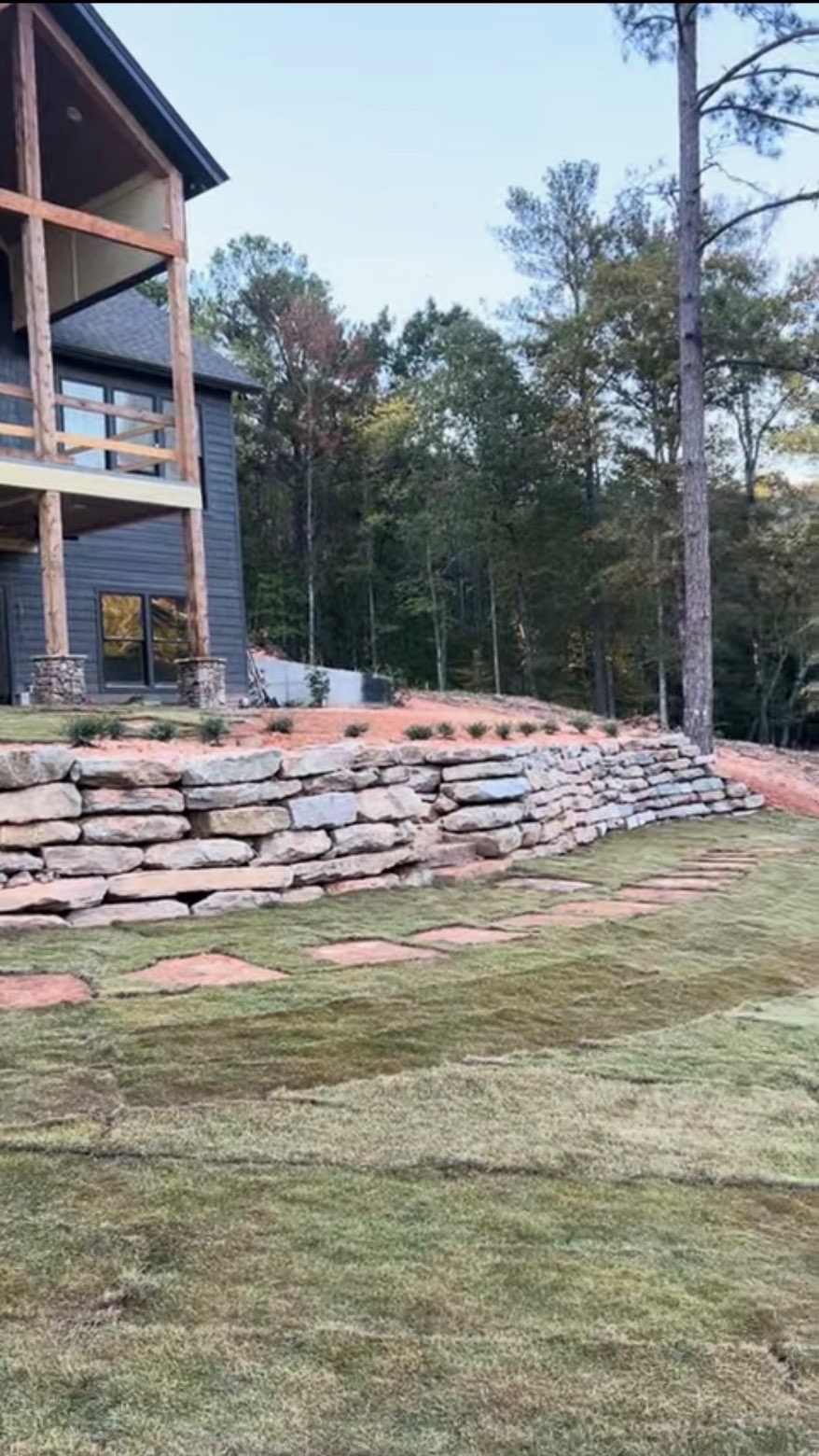 Stone retaining wall and sod install