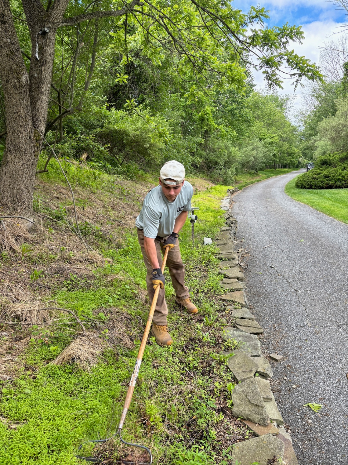 DCD Laborers edging a driveway
